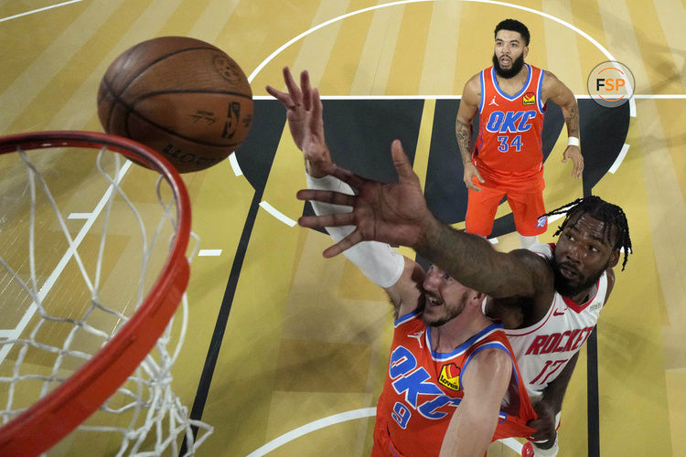 Dec 14, 2024; Las Vegas, Nevada, USA; Oklahoma City Thunder guard Alex Caruso (9) and Houston Rockets forward Tari Eason (17) reach for the ball during the first half in a semifinal of the 2024 Emirates NBA Cup at T-Mobile Arena. Credit: Kyle Terada/Pool Photo-Imagn Images