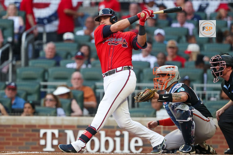Jul 4, 2025; Atlanta, Georgia, USA; Atlanta Braves third baseman Austin Riley (27) hits a double against the Baltimore Orioles in the third inning at Truist Park. Credit: Brett Davis-Imagn Images
