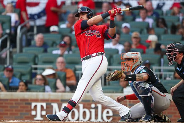 Jul 4, 2025; Atlanta, Georgia, USA; Atlanta Braves third baseman Austin Riley (27) hits a double against the Baltimore Orioles in the third inning at Truist Park. Mandatory Credit: Brett Davis-Imagn Images
