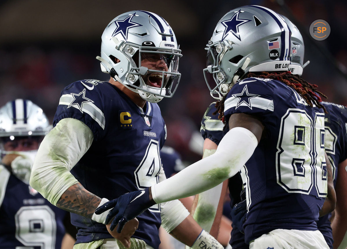 Jan 16, 2023; Tampa, Florida, USA; Dallas Cowboys quarterback Dak Prescott (4) reacts with wide receiver CeeDee Lamb (88) after throwing a touchdown pass against the Tampa Bay Buccaneers in the second half during the wild card game at Raymond James Stadium. Credit: Kim Klement-USA TODAY Sports