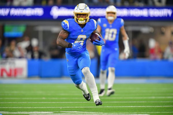 Dec 8, 2025; Inglewood, California, USA;  Los Angeles Chargers running back Omarion Hampton (8) runs against the Philadelphia Eagles in overtime at SoFi Stadium. Mandatory Credit: Gary A. Vasquez-Imagn Images