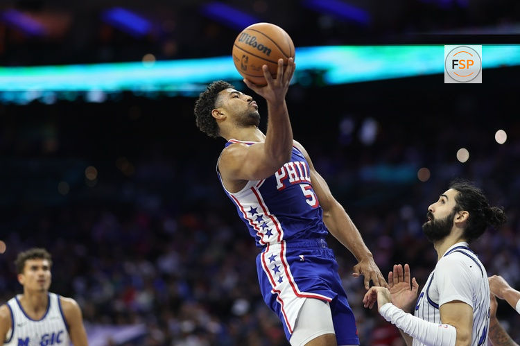 Oct 27, 2025; Philadelphia, Pennsylvania, USA; Philadelphia 76ers guard Quentin Grimes (5) drives for a shot against Orlando Magic center Goga Bitadze (35) during the third quarter at Xfinity Mobile Arena. Credit: Bill Streicher-Imagn Images