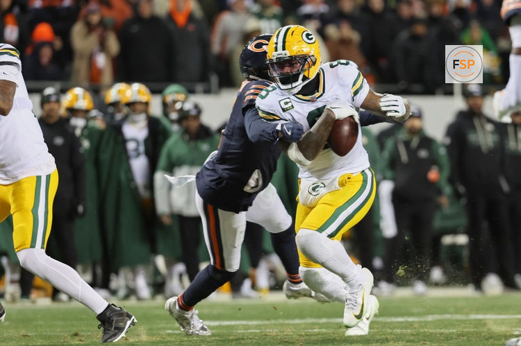 Dec 20, 2025; Chicago, Illinois, USA; Green Bay Packers running back Josh Jacobs (8) fumbles the ball against Chicago Bears linebacker Tremaine Edmunds (49) during the third quarter at Soldier Field. Credit: Mike Dinovo-Imagn Images
