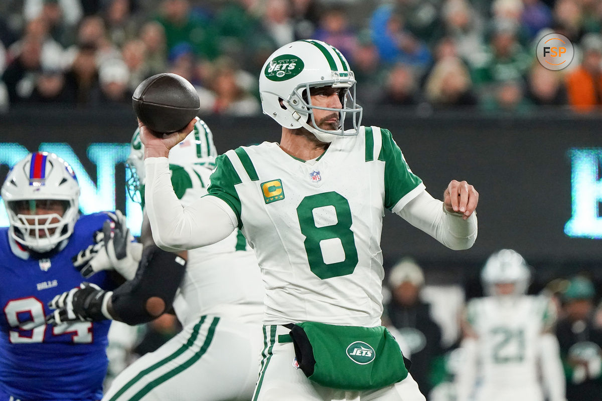 Oct 14, 2024; East Rutherford, New Jersey, USA; New York Jets quarterback Aaron Rodgers (8) throws a pass during the first half against the Buffalo Bills at MetLife Stadium. Credit: Lucas Boland-Imagn Images