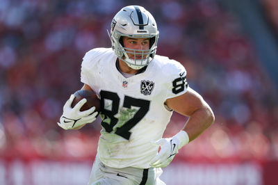 Dec 8, 2024; Tampa, Florida, USA; Las Vegas Raiders tight end Michael Mayer (87) runs with the ball against the Tampa Bay Buccaneers in the second quarter at Raymond James Stadium. Mandatory Credit: Nathan Ray Seebeck-Imagn Images