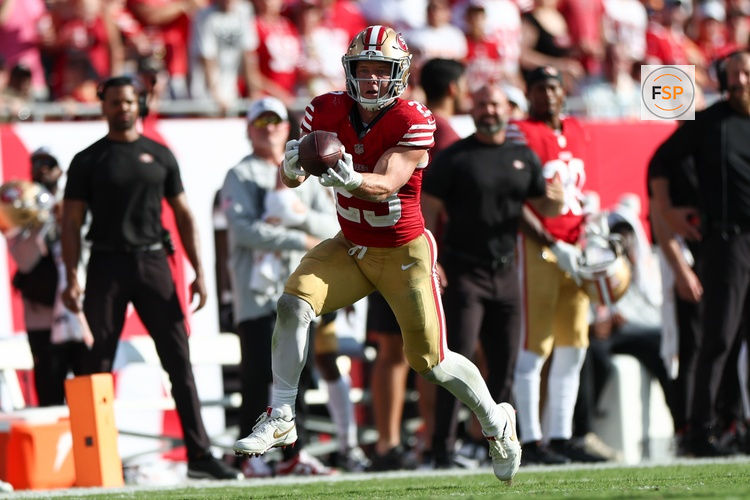 Nov 10, 2024; Tampa, Florida, USA; San Francisco 49ers running back Christian McCaffrey (23) receives a pass against the Tampa Bay Buccaneers in the fourth quarter at Raymond James Stadium. Credit: Nathan Ray Seebeck-Imagn Images