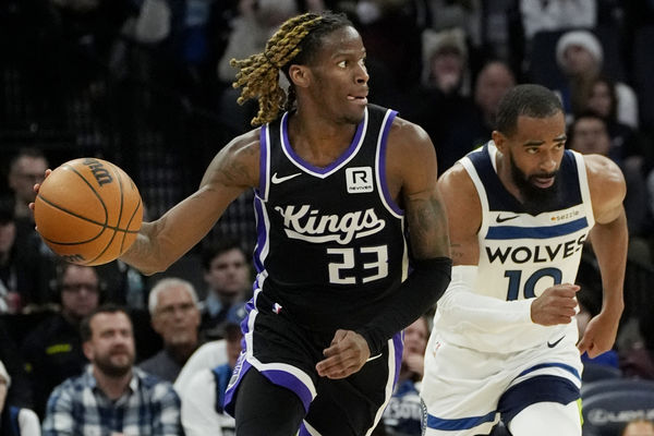 Feb 3, 2025; Minneapolis, Minnesota, USA; Sacramento Kings guard Keon Ellis (23) brings the ball up court after stealing it from the Minnesota Timberwolves in the third quarter at Target Center. Mandatory Credit: Bruce Kluckhohn-Imagn Images