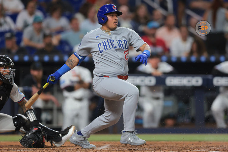 May 19, 2025; Miami, Florida, USA; Chicago Cubs designated hitter Moises Ballesteros (25) hits an RBI single against the Miami Marlins during the sixth inning at loanDepot Park. Credit: Sam Navarro-Imagn Images