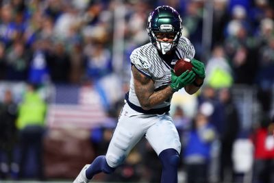 Dec 18, 2025; Seattle, Washington, USA; Seattle Seahawks wide receiver Jaxon Smith-Njigba (11) runs for a touchdown against the Los Angeles Rams in overtime at Lumen Field. Mandatory Credit: Kevin Ng-Imagn Images