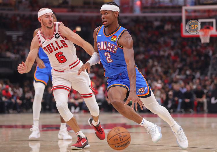 CHICAGO, IL - OCTOBER 25: Oklahoma City Thunder guard Shai Gilgeous-Alexander (2) drives to the basket past Chicago Bulls guard Alex Caruso (6) during a NBA game between the Oklahoma City Thunder and the Chicago Bulls on October 25, 2023 at the United Center in Chicago, IL. (Photo by Melissa Tamez/Icon Sportswire)