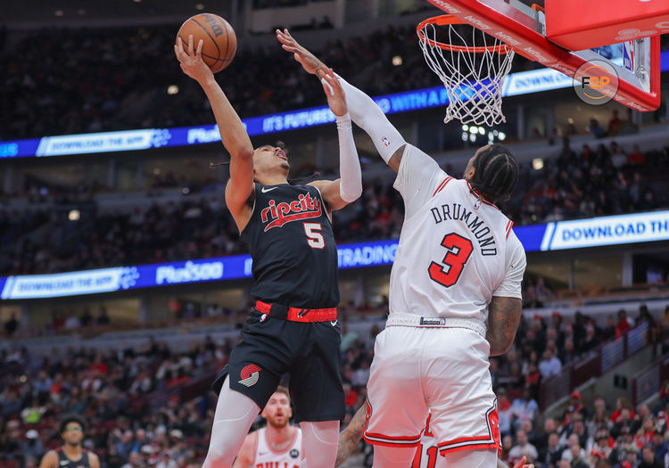 CHICAGO, IL - MARCH 18: Dalano Banton #5 of the Portland Trail Blazers drives to the basket against Andre Drummond #3 of the Chicago Bulls during the first half at the United Center on March 18, 2024 in Chicago, Illinois. (Photo by Melissa Tamez/Icon Sportswire)