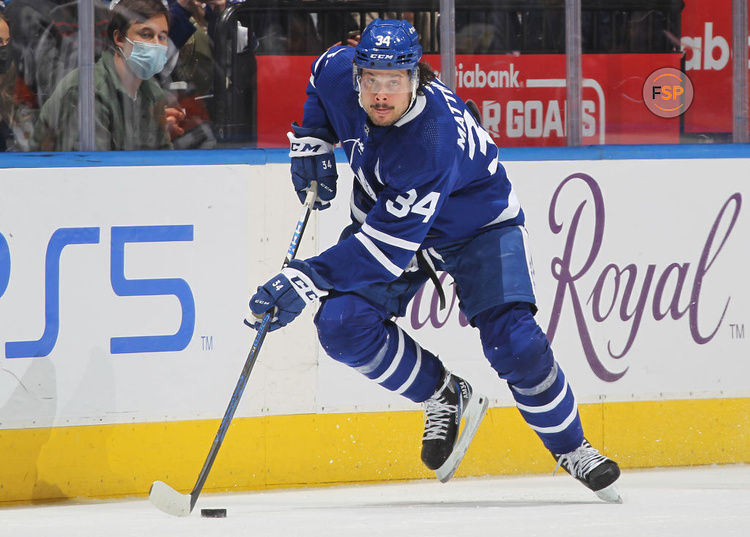 TORONTO, ON - MARCH 5:  Auston Matthews #34 of the Toronto Maple Leafs skates up ice with the puck against the Vancouver Canucks during an NHL game at Scotiabank Arena on March 5, 2022 in Toronto, Ontario, Canada. (Photo by Claus Andersen/Getty Images) *** Local Caption *** Auston Matthews