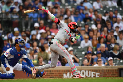 Sep 29, 2024; Chicago, Illinois, USA; Cincinnati Reds shortstop Elly De La Cruz (44) hits a two-run triple during the tenth inning against the Chicago Cubs at Wrigley Field. Mandatory Credit: Patrick Gorski-Imagn Images