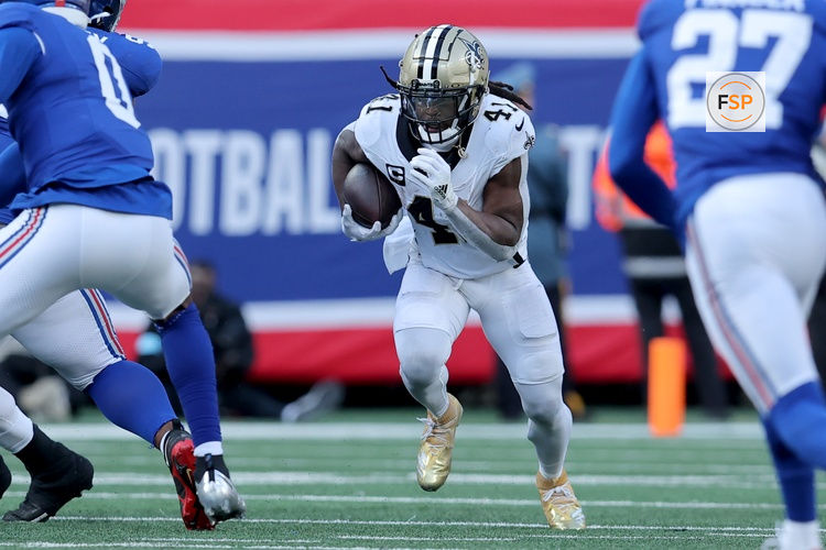 Dec 8, 2024; East Rutherford, New Jersey, USA; New Orleans Saints running back Alvin Kamara (41) runs with the ball against the New York Giants during the second quarter at MetLife Stadium. Credit: Brad Penner-Imagn Images