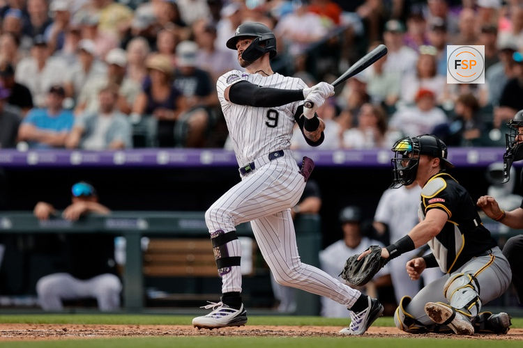 Aug 2, 2025; Denver, Colorado, USA; Colorado Rockies center fielder Brenton Doyle (9) watches his ball on an RBI dingle in the sixth inning against the Pittsburgh Pirates at Coors Field. Credit: Isaiah J. Downing-Imagn Images