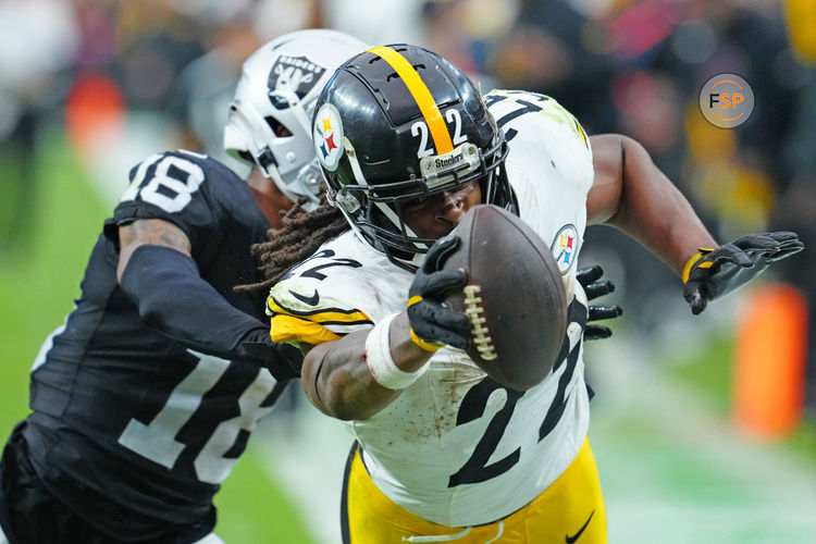 Oct 13, 2024; Paradise, Nevada, USA; Pittsburgh Steelers running back Najee Harris (22) is pushed out of bounds by Las Vegas Raiders cornerback Jack Jones (18) during the third quarter at Allegiant Stadium. Credit: Stephen R. Sylvanie-Imagn Images