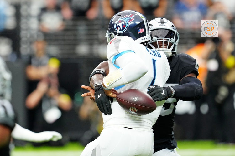 Oct 12, 2025; Paradise, Nevada, USA; Las Vegas Raiders linebacker Devin White (45) hits Tennessee Titans quarterback Cam Ward (1) and causes a fumble during the second half at Allegiant Stadium. Credit: Stephen R. Sylvanie-Imagn Images