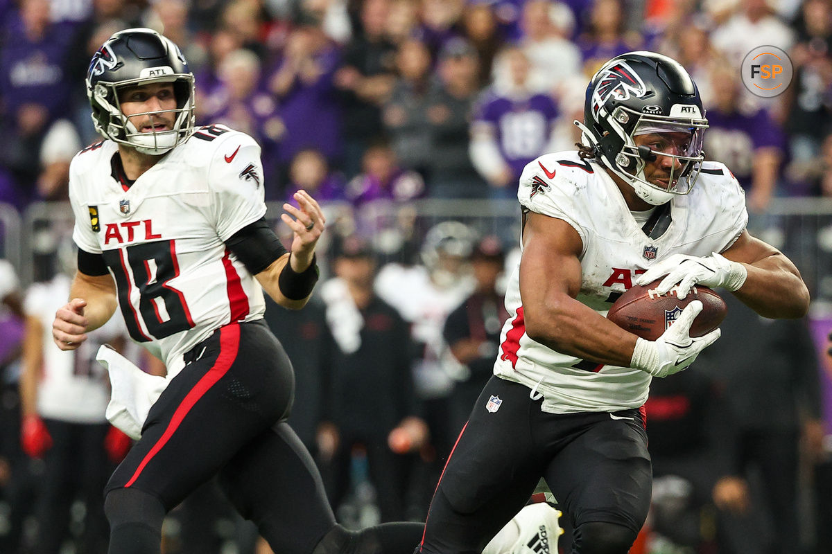 Dec 8, 2024; Minneapolis, Minnesota, USA; Atlanta Falcons running back Bijan Robinson (7) runs the ball for a two-point conversion against the Minnesota Vikings during the third quarter at U.S. Bank Stadium. Credit: Matt Krohn-Imagn Images