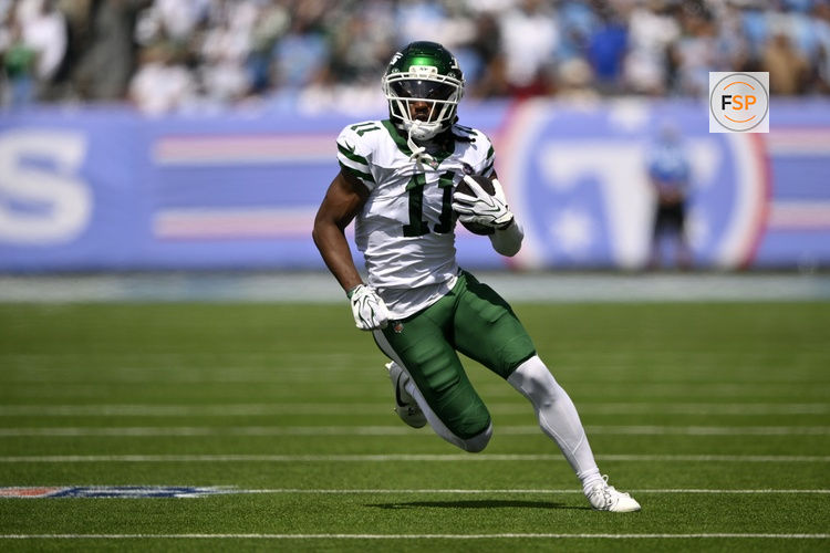 Sep 13, 2026; Nashville, Tennessee, USA;  New York Jets wide receiver Omar Cooper J.r (11) runs with the ball against the Tennessee Titans during the first quarter at Nissan Stadium.  Credit: Steve Roberts-Imagn Images