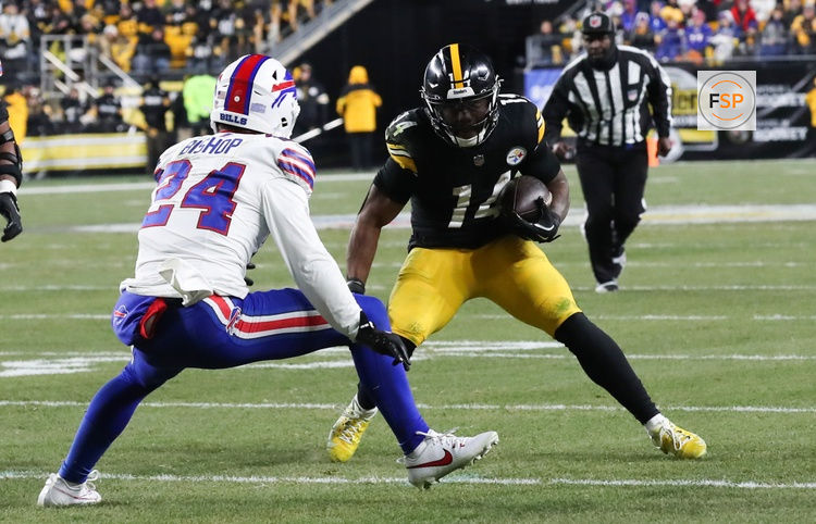 Nov 30, 2025; Pittsburgh, Pennsylvania, USA; Pittsburgh Steelers running back Kenneth Gainwell (14) rushes as Buffalo Bills safety Cole Bishop (24) defends during the fourth quarter at Acrisure Stadium. Credit: Charles LeClaire-Imagn Images