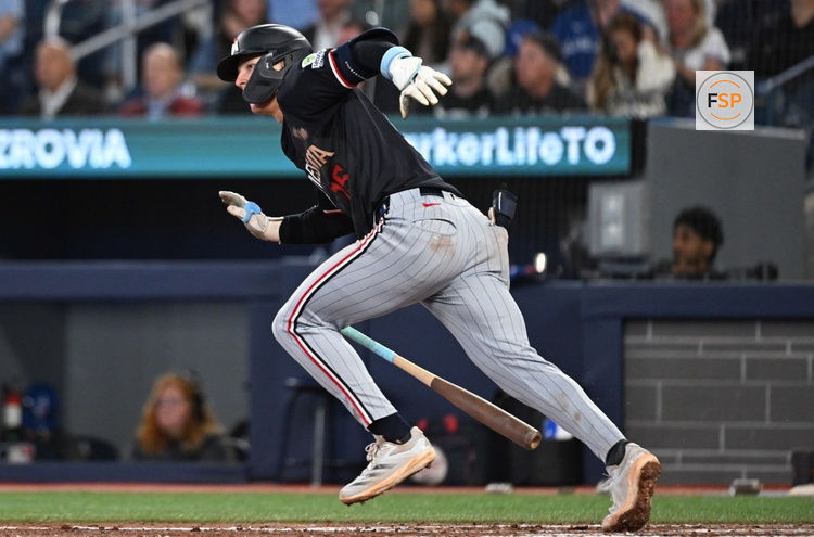 Aug 26, 2025; Toronto, Ontario, CAN;  Minnesota Twins second baseman Luke Keaschall (15) hits a two run home run against the Toronto Blue Jays in the sixth inning at Rogers Centre. Credit: Dan Hamilton-Imagn Images