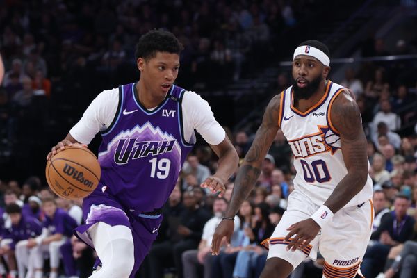 Oct 27, 2025; Salt Lake City, Utah, USA; Utah Jazz guard Ace Bailey (19) drives against Phoenix Suns forward Royce O'Neale (00) during the second half at Delta Center. Mandatory Credit: Rob Gray-Imagn Images