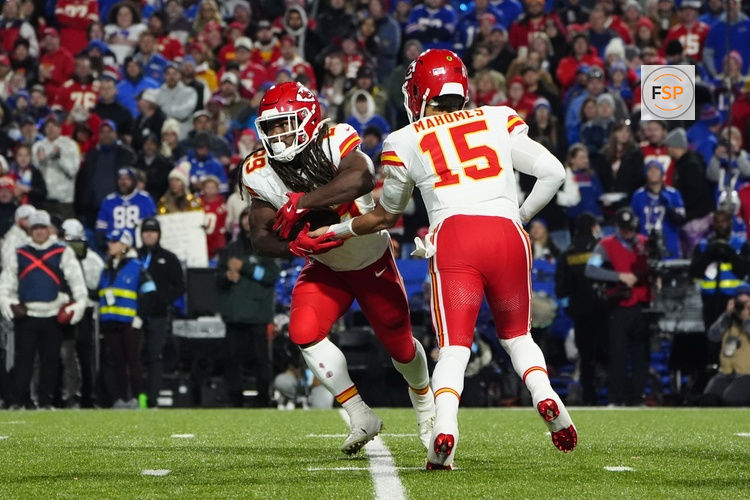 Nov 17, 2024; Orchard Park, New York, USA; Kansas City Chiefs quarterback Patrick Mahomes (15) hands the ball off to Kansas City Chiefs running back Kareem Hunt (29) against the Buffalo Bills during the second half at Highmark Stadium. Credit: Gregory Fisher-Imagn Images