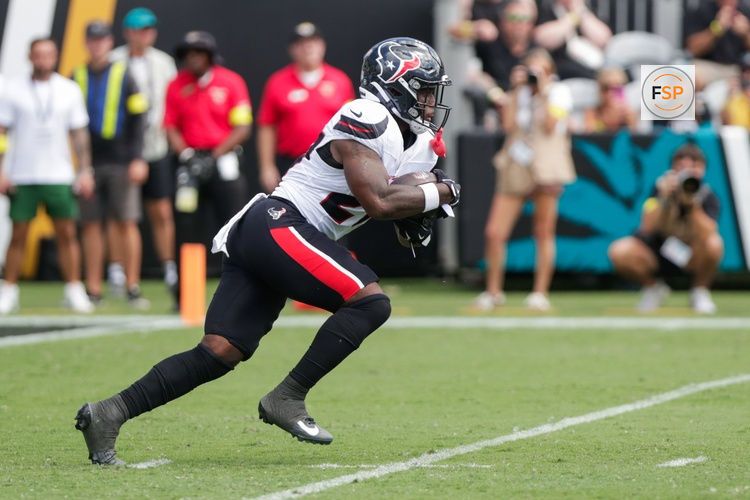 Sep 21, 2025; Jacksonville, Florida, USA; Houston Texans running back Woody Marks (27) runs with the the ball during the second quarter against the Jacksonville Jaguars at EverBank Stadium. Credit: Travis Register-Imagn Images