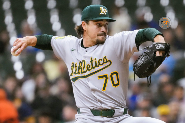 Apr 18, 2025; Milwaukee, Wisconsin, USA;  Athletics pitcher J.T. Ginn (70) throws a pitch during the first inning against the Milwaukee Brewers at American Family Field. Credit: Jeff Hanisch-Imagn Images