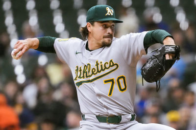 Apr 18, 2025; Milwaukee, Wisconsin, USA;  Athletics pitcher J.T. Ginn (70) throws a pitch during the first inning against the Milwaukee Brewers at American Family Field. Mandatory Credit: Jeff Hanisch-Imagn Images