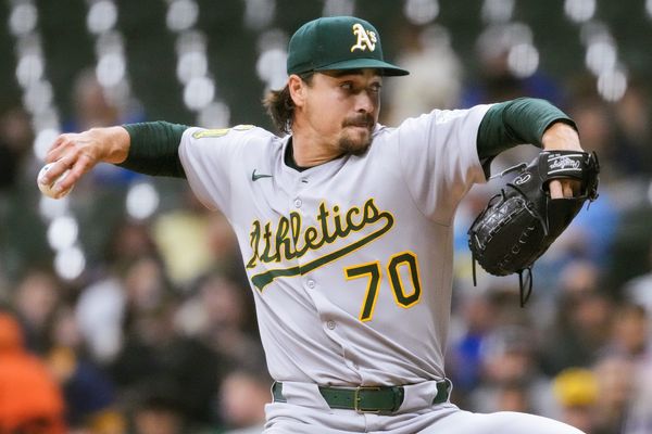 Apr 18, 2025; Milwaukee, Wisconsin, USA;  Athletics pitcher J.T. Ginn (70) throws a pitch during the first inning against the Milwaukee Brewers at American Family Field. Mandatory Credit: Jeff Hanisch-Imagn Images