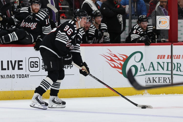 Dec 21, 2025; Newark, New Jersey, USA;   New Jersey Devils center Jack Hughes (86) controls the puck against the Buffalo Sabres during the third period at Prudential Center. Credit: Thomas Salus-Imagn Images