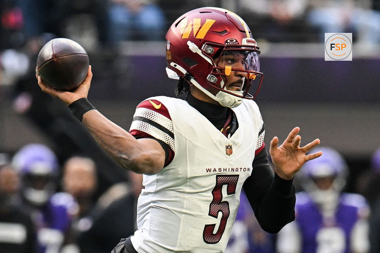 Dec 7, 2025; Minneapolis, Minnesota, USA; Washington Commanders quarterback Jayden Daniels (5) drops back to pass against the Minnesota Vikings during the first half at U.S. Bank Stadium. Credit: Jeffrey Becker-Imagn Images
