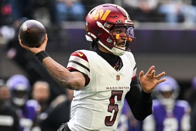 Dec 7, 2025; Minneapolis, Minnesota, USA; Washington Commanders quarterback Jayden Daniels (5) drops back to pass against the Minnesota Vikings during the first half at U.S. Bank Stadium. Mandatory Credit: Jeffrey Becker-Imagn Images