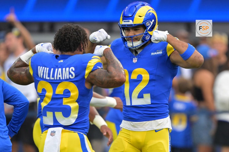 Sep 28, 2025; Inglewood, California, USA; Los Angeles Rams running back Kyren Williams (23) and wide receiver Puka Nacua (12) flex as they get ready for the game against the Indianapolis Colts at SoFi Stadium. Credit: Jayne Kamin-Oncea-Imagn Images