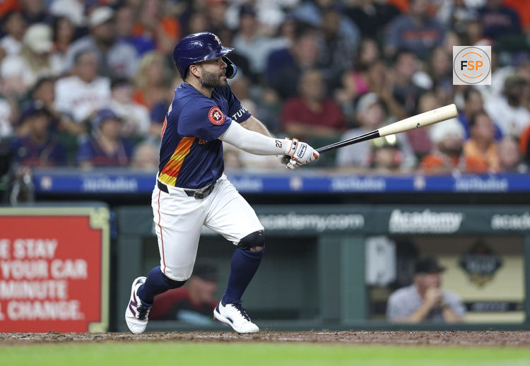Sep 8, 2024; Houston, Texas, USA; Houston Astros second baseman Jose Altuve (27) hits an RBI single during the fifth inning against the Arizona Diamondbacks at Minute Maid Park. Credit: Troy Taormina-Imagn Images