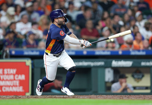 Sep 8, 2024; Houston, Texas, USA; Houston Astros second baseman Jose Altuve (27) hits an RBI single during the fifth inning against the Arizona Diamondbacks at Minute Maid Park. Mandatory Credit: Troy Taormina-Imagn Images