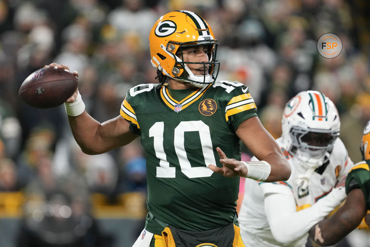 Nov 28, 2024; Green Bay, Wisconsin, USA;  Green Bay Packers quarterback Jordan Love (10) throws a pass during the first quarter against the Miami Dolphins at Lambeau Field. Credit: Jeff Hanisch-Imagn Images