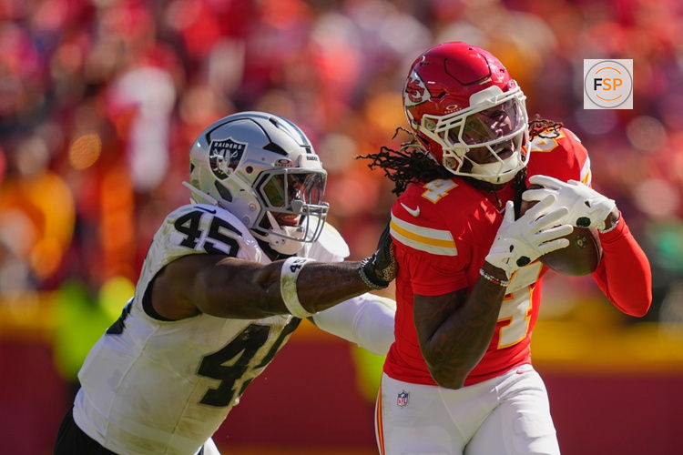 Oct 19, 2025; Kansas City, Missouri, USA; Kansas City Chiefs wide receiver Rashee Rice (4) makes a reception defended by Las Vegas Raiders linebacker Devin White (45) during the second quarter of the game at GEHA Field at Arrowhead Stadium. Credit: Jay Biggerstaff-Imagn Images