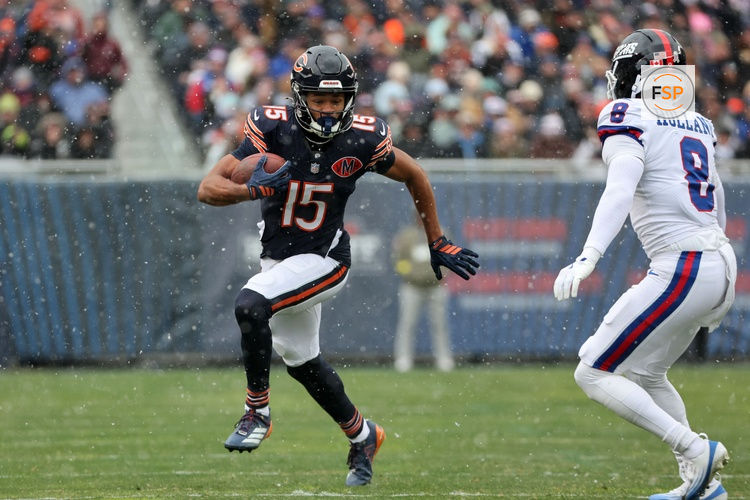Nov 9, 2025; Chicago, Illinois, USA; Chicago Bears wide receiver Rome Odunze (15) makes a catch against New York Giants safety Jevon Holland (8) during the first half at Soldier Field. Credit: Mike Dinovo-Imagn Images