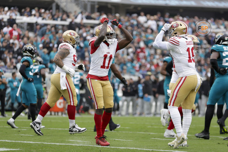 JACKSONVILLE, FL - NOVEMBER 12: San Francisco 49ers wide receiver Brandon Aiyuk (11) and San Francisco 49ers wide receiver Deebo Samuel (19) celebrate a touchdown during the game between the San Francisco 49ers and theJacksonville Jaguars on November 12, 2023 at  EverBank Stadium in Jacksonville, Florida. (Photo by David Rosenblum/Icon Sportswire)