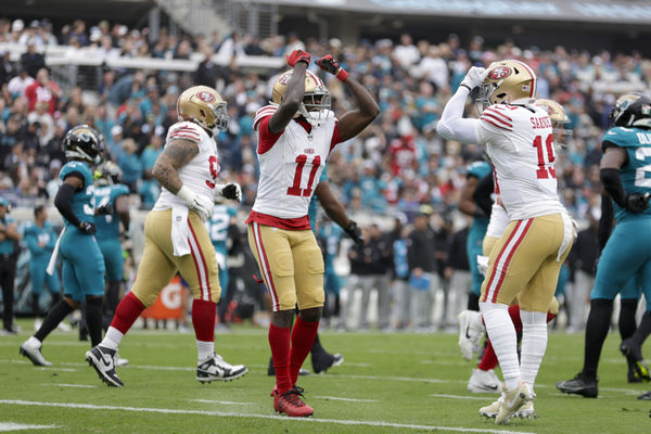 JACKSONVILLE, FL - NOVEMBER 12: San Francisco 49ers wide receiver Brandon Aiyuk (11) and San Francisco 49ers wide receiver Deebo Samuel (19) celebrate a touchdown during the game between the San Francisco 49ers and theJacksonville Jaguars on November 12, 2023 at  EverBank Stadium in Jacksonville, Florida. (Photo by David Rosenblum/Icon Sportswire)