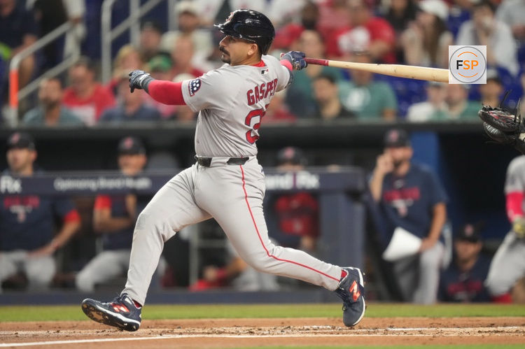 Aug 25, 2026; Miami, Florida, USA;  Boston Red Sox designated hitter Mickey Gasper (30) hits a solo home run in the second inning against the Miami Marlins at loanDepot Park.  Credit: Jim Rassol-Imagn Images