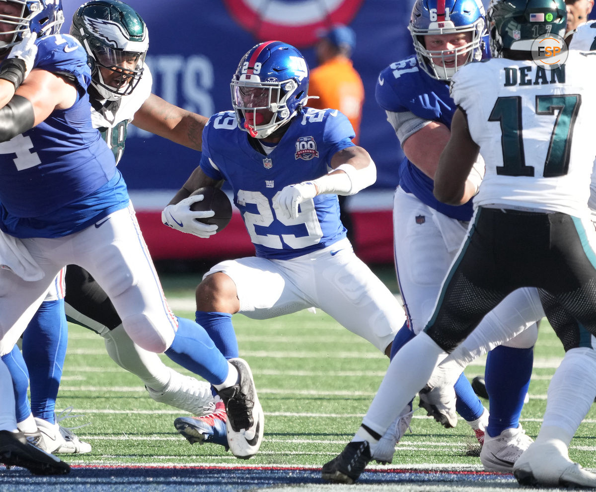 Oct 20, 2024; East Rutherford, New Jersey, USA;  New York Giants running back Tyrone Tracy Jr. (29) runs against the Philadelphia Eagles during the second half at MetLife Stadium. Credit: Robert Deutsch-Imagn Images