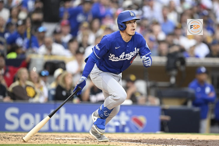 Jun 27, 2026; San Diego, California, USA; Los Angeles Dodgers second baseman Tommy Edman (25) hits an RBI triple during the sixth inning against the San Diego Padres at Petco Park. Credit: Denis Poroy-Imagn Images
