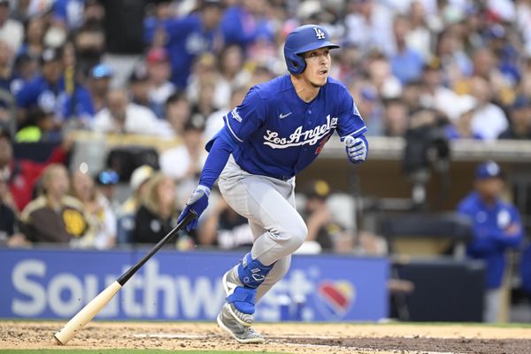 Jun 27, 2026; San Diego, California, USA; Los Angeles Dodgers second baseman Tommy Edman (25) hits an RBI triple during the sixth inning against the San Diego Padres at Petco Park. Mandatory Credit: Denis Poroy-Imagn Images