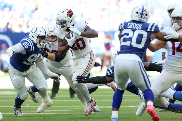 Oct 12, 2025; Indianapolis, Indiana, USA; Arizona Cardinals running back Bam Knight (20) controls the ball against the Indianapolis Colts during the second quarter of the game at Lucas Oil Stadium. Mandatory Credit: Trevor Ruszkowski-Imagn Images