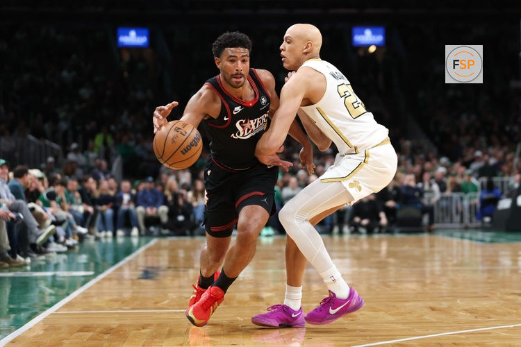 Mar 1, 2026; Boston, Massachusetts, USA; Philadelphia 76ers guard Quentin Grimes (5) drives to the basket defended by Boston Celtics forward Jordan Walsh (27) during the first half at TD Garden. Credit: Paul Rutherford-Imagn Images
