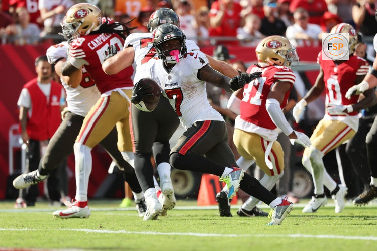Nov 10, 2024; Tampa, Florida, USA; Tampa Bay Buccaneers running back Bucky Irving (7) runs the ball in for a touchdown against the San Francisco 49ers during the second half at Raymond James Stadium. Credit: Kim Klement Neitzel-Imagn Images