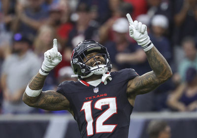 Nov 24, 2024; Houston, Texas, USA; Houston Texans wide receiver Nico Collins (12) celebrates after a reception during the second quarter against the Tennessee Titans at NRG Stadium. Mandatory Credit: Troy Taormina-Imagn Images